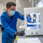 <p>Junpyo Kwon, a Ph.D. student researcher from the Xu Group at UC Berkeley, is shown holding a recyclable, biodegradable printed circuit. The advance could divert wearable devices and other flexible electronics from landfill, and mitigate the health and environmental hazards posed by heavy metal waste. (Credit: Marilyn Sargent/Berkeley Lab)</p>
 