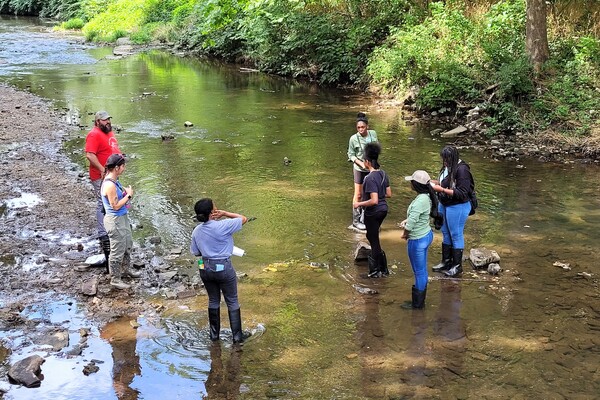 Jazmin Ricks and high school students from Paul Robeson High School at Cobbs Creek. 