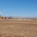 <p>Mud volcanoes and mudpots next to the EnergySource Minerals power plant at the edge of the Salton Sea. (Credit: Michael McKibben/UC Riverside)</p>
