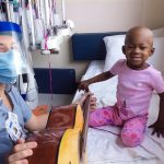 <p>Music Therapist Erica Cyrul and a young patient at Children’s Hospital of Michigan, part of the Detroit Medical Center. Cyrul and Dr. Jody Stark provide music therapy through a partnership between CHM, The Children&#8217;s Foundation, and MSU CMS-D.</p>
