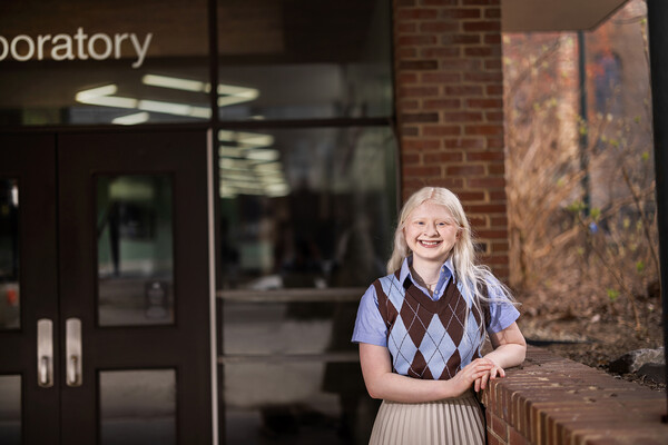 Sarah Kane stands outside the front entrance of David Rittenhouse Laboratory