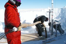<p>Researchers insert a vacuum line down a borehole in Megadunes, Antarctica, to pump air out of the snow pack. Researchers at UCI analyzed the &#8220;firn&#8221; air to determine that the amount of molecular hydrogen in Earth&#8217;s atmosphere has increased by 70 percent since the mid 1800s. </p>
