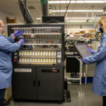 <p>Michael Connolly (left) and Natalia Molchanova (right) preparing antiviral peptoid samples at the Molecular Foundry. (Credit: Marilyn Sargent/Berkeley Lab)</p>

