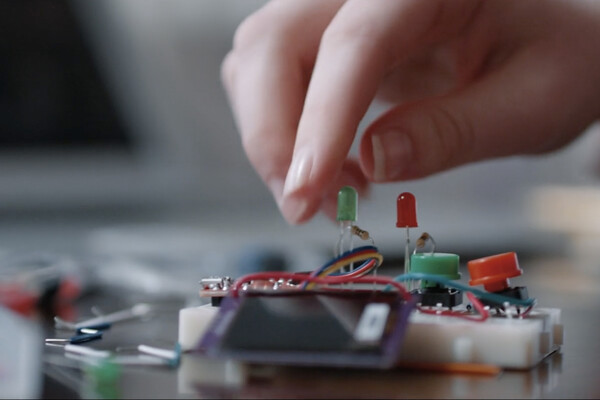 hand using a circuit board