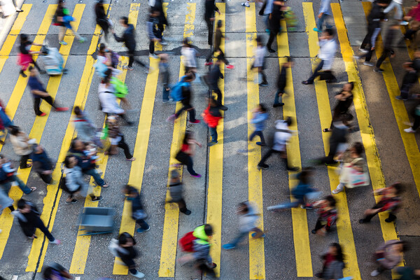 people walking across an intersection